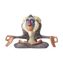 Jim Shore's Disney Traditions Rafiki figurine from The Lion King, meditating with vibrant, painted details on a stylized base.