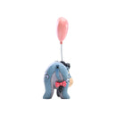 Disney Traditions figurine of Eeyore with a pink balloon from behind, showcasing Jim Shore's signature quilt pattern design.