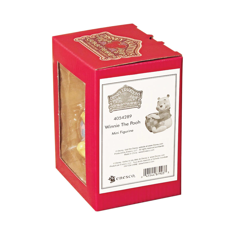 Packaging box for Jim Shore Disney Traditions Mini Pooh figurine, displaying product code 4054289, with a clear viewing window and intricate folk art-inspired patterns on red background.