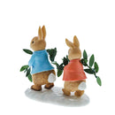 Photo from the back: Figurine of Peter Rabbit and Flopsy carrying the leaves