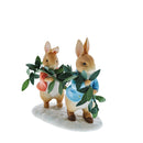 Figurine of Peter Rabbit and Flopsy carrying the leaves