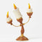 Jim Shore Disney Traditions collectible figurine featuring the character Lumiere from Beauty and the Beast with three flickering candles.