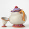 Painted figurine of Mrs. Potts with separate Chip cup, from the Disney Traditions collection by Jim Shore, displaying textured details and soft color palette.