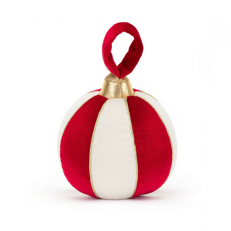 A plush toy shaped like a red and white striped bauble with a gold top and a red loop for hanging.