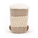 A fluffy coffee cup plush toy with a beige body, ribbed texture, creamy top, and brown base.