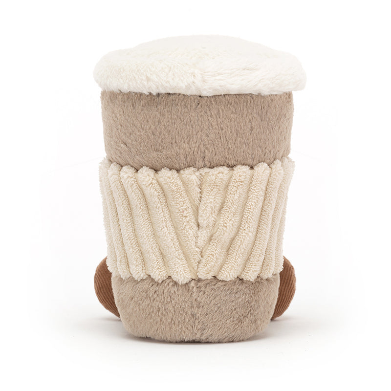 A fluffy coffee cup plush toy with a beige body, ribbed texture, creamy top, and brown base.