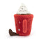 A plush toy resembling a red mug with a cheerful face, topped with soft white "whipped cream." The mug has embroidered stars, a side handle, and cute brown feet.