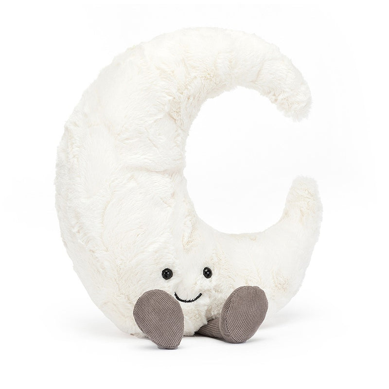 A plush crescent moon toy with a soft white texture. The moon has an adorable smiling face with black eyes and a curved mouth. It rests on two small, grey, rounded feet.