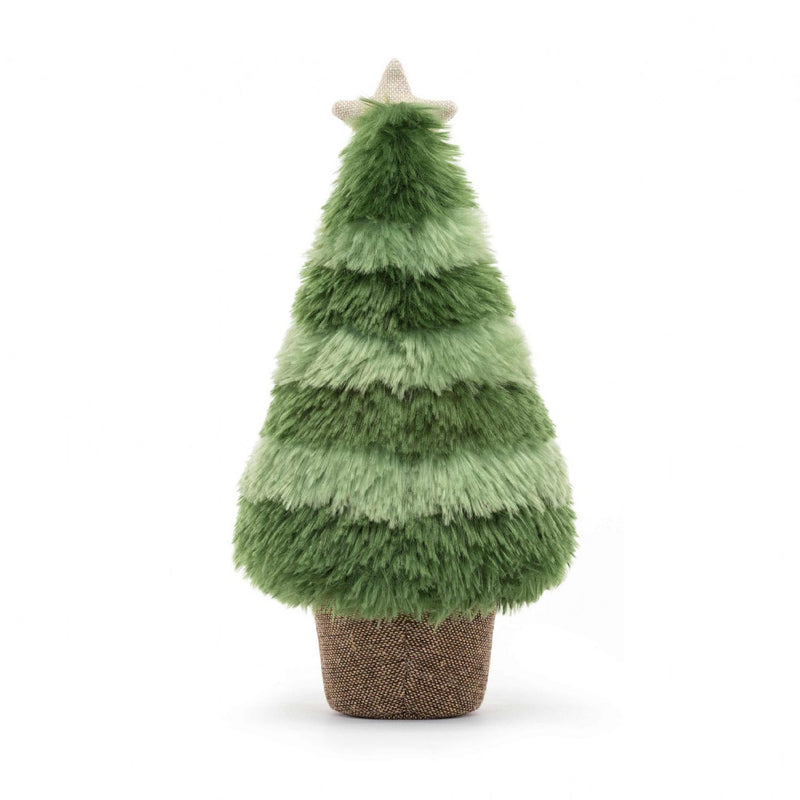 A fluffy green Christmas tree toy with a beige star on top, seated on a textured brown base.