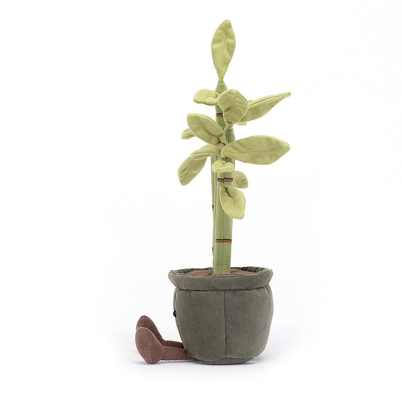 A plush bamboo plant with five green linen stems, red-brown stitches, suede-like leaves, sitting in a suede pot with fluffy soil. It has corded feet and a cheerful face.