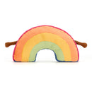 A plush toy shaped like a rainbow, showcasing pastel stripes in peach, yellow, and turquoise. 