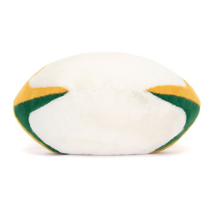 A plush toy shaped like a rugby ball, predominantly white with green and yellow curved stripes on its sides. The toy appears soft with a fuzzy texture.