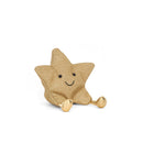 A sparkling gold star plush toy with a cheerful smile and golden booties. It sits upright with a welcoming expression, exuding warmth and charm.