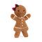 The image depicts a smiling gingerbread plush toy, dressed in white stitched icing details and accessorized with a tartan bow on its head, giving a waving gesture.