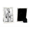 A silverplated bamboo photo frame with a 10cm x 15cm photo of flowers, displayed in portrait orientation, with a black flock backing, presented in a branded giftbox.